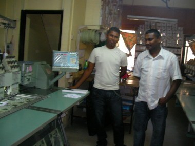 boys at computerised embroidery place