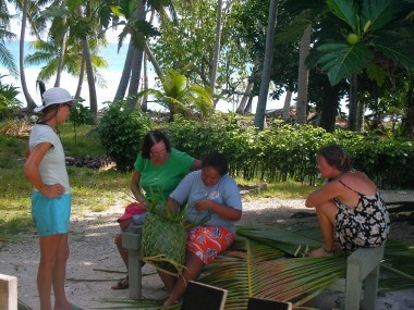 ladies weaving palm fronds