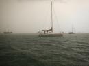 Gail force winds and rian at anchorage in Playita: Rain at Playita, waving to Peter on Selya
