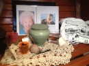 My own Dia de los Muertos altar, with photos of my Mom and my friend Steve, and symbols of coffee beans, an urn with ashes, and other important items that meant something to them.  Water if for them if they get thirsty and a candle to light the way.