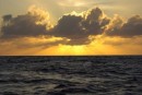 From when the sun first touches the ocean it takes about 2 minutes to disappear.