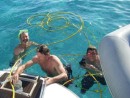Paul organising the air compressor for Sandy and Aiden to dive under the boat.