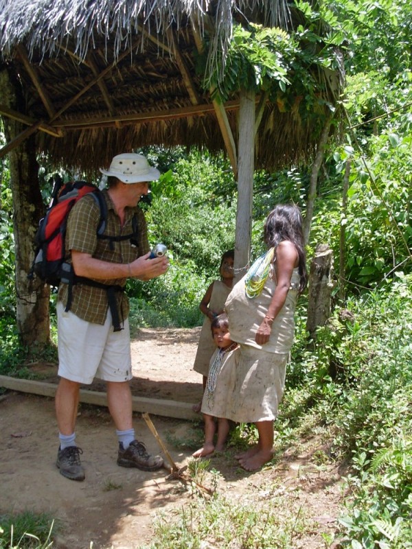 Andy chatting to a Kogui mother and her two children.  Women ideally produce a child annually.