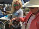 Meeting the locals: Meeting a young alligator at the Seafood Festival