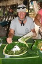17) Kathy (Bold Spirit) digging in to some seaweed.  It was yummy!  This is also to show Tongan disposable plates... they