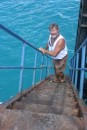 Glen climbing up the ladder/staircase on the Christmas Island wharf - it was steep!