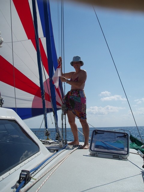 Dianne hoists the Indonesian Courtesy Flag as we approach Kupang