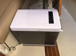 52 quart powered cooler: Cooler/freezer by Aspenora.  Has a compressor that cools or freezes 40 to 20 degrees.  Only draws 4 amps when working.  Costs half the price of similar Dometic or Waco coolers.  I’ll report more after a month of use.