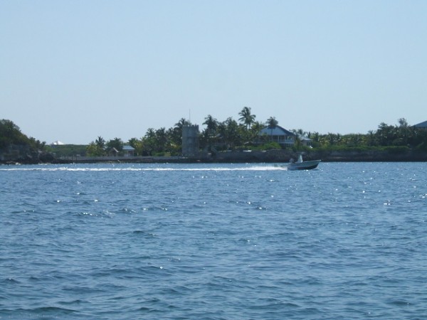 House with seaplane hangar, boat ramp, and turret