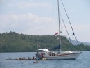 Friends yacht anchored in TK Bari, Indonesia, some village